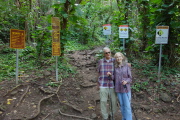 David and Kay in front of the warning signs