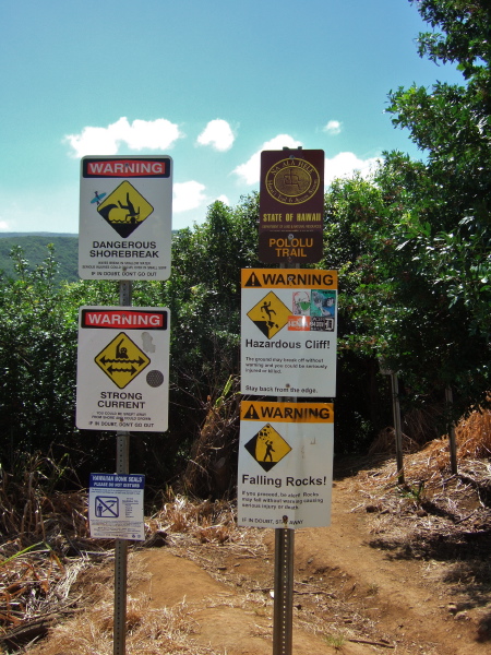 Warning signs for hikers and beach-goers