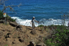 Bill stands at the edge of the crumbling cliff.