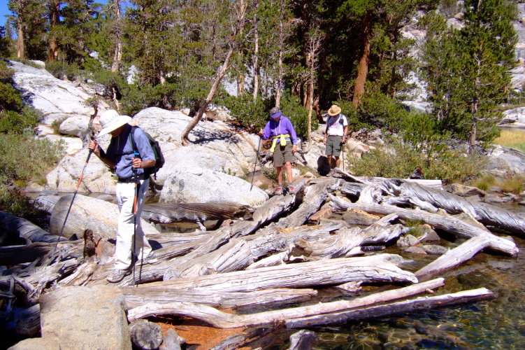 David, Alice, and Ron cross the outlet of Blue Lake on the abundant debris.