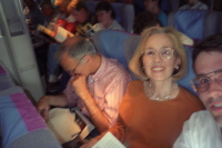 David, Kay, and Bill tucked into their seats.