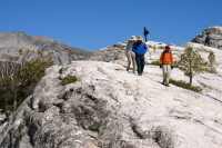 David, Ron Bobb, and Zach Kaplan walking to the west side of Lembert Dome.