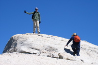 Zach Kaplan on the summit of Lembert Dome (9450ft); Ron Bobb climbs the last few feet.