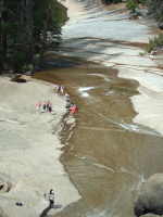 Tourists examine the water's edge on the Silver Apron.