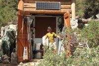 A worker services the solar toilets at the top of Nevada Fall.