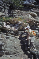 David examines the rock along the trail.