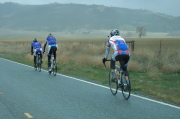 Team Blue Train climb up out of Bitterwater Valley under a steady rain.