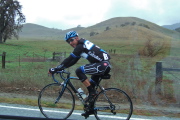 A rider on Team Don Chapin climbs up Bear Valley.