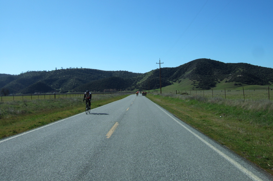 Riders in Bitterwater Valley, while one team holds a conference on the road