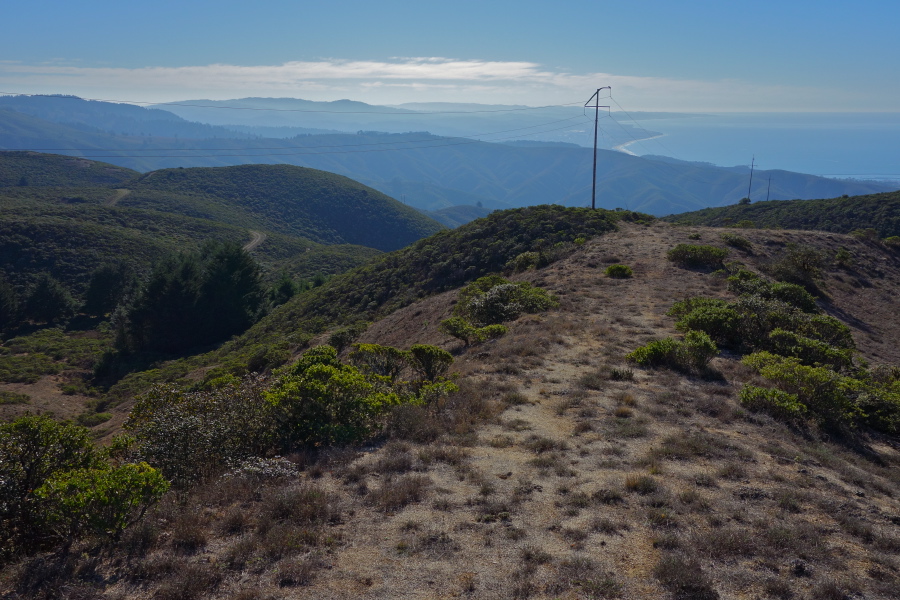 Trail heads downhill along the power lines.