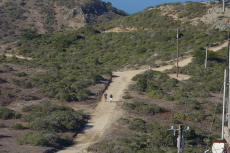 Two hikers approach North Peak.