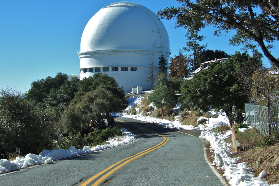 Snow lines the road past the Shane Reflector.