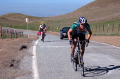 Chris Isley (r) is determined not to get caught by Tim Clark at the top of Sierra Rd.