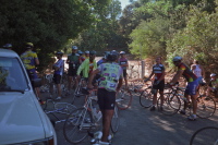 Riders relax at the end of the road after the climb.