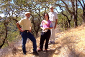 Frank, Stella, and David near the Lichen-draped oaks.