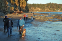 The group walks beneath the Capitola cliffs.