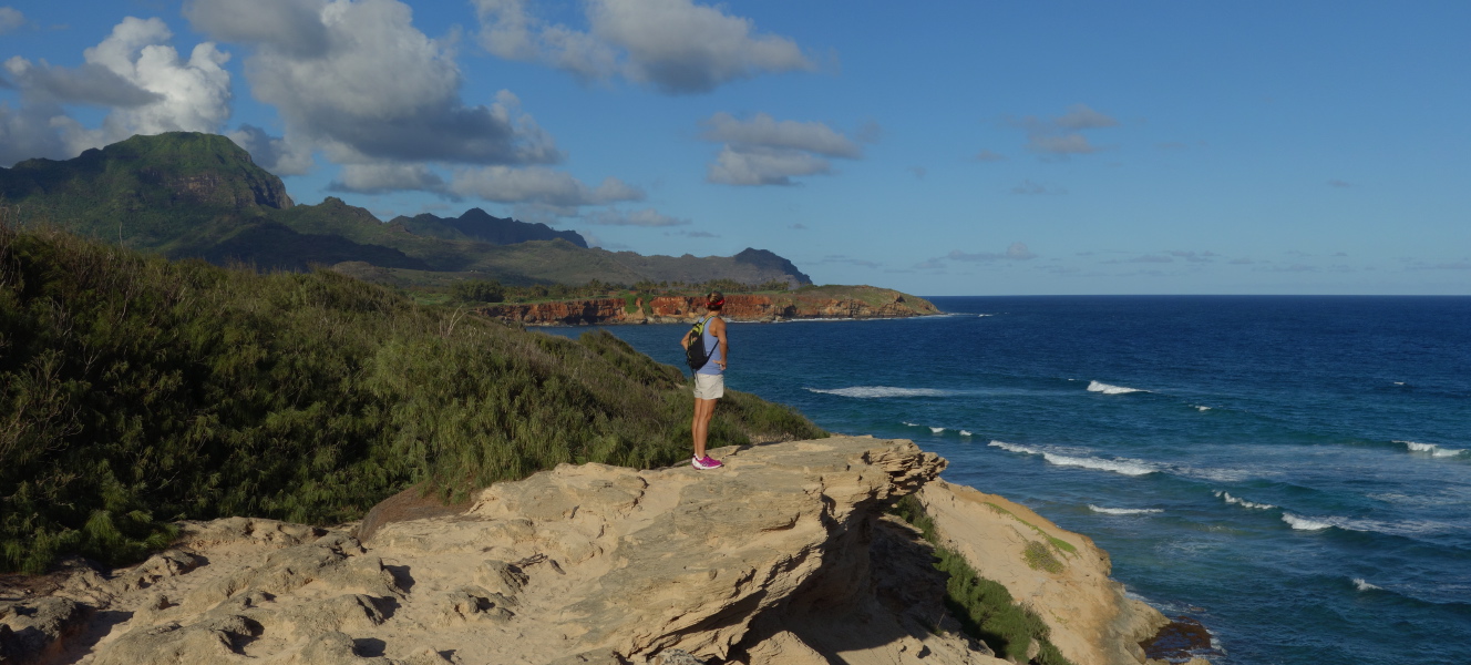 Laura enjoys the view from the lithified cliffs of Makawehi.