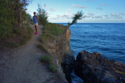 Laura walks along more lithified cliffs near Kamala Point.