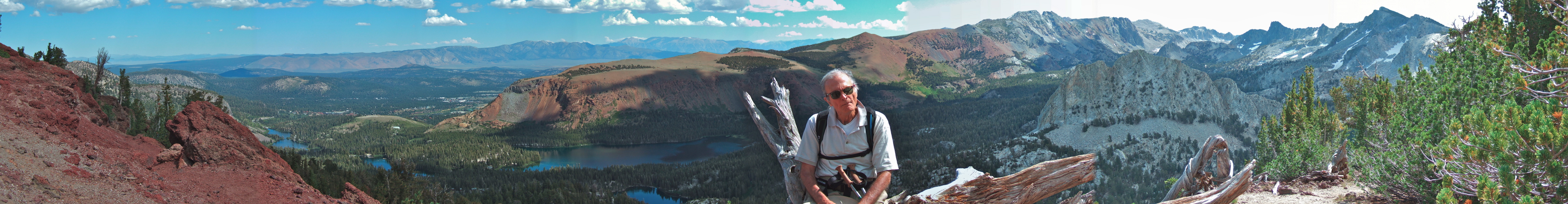 David enjoys resting on a dead tree on Mammoth Crest.