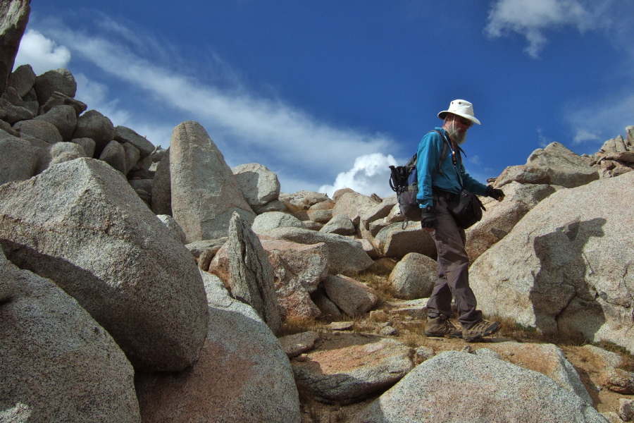 We decide to head directly east and down through the boulders.