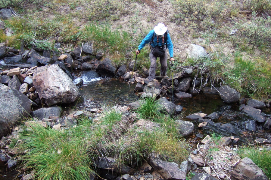 Frank crosses the creek.