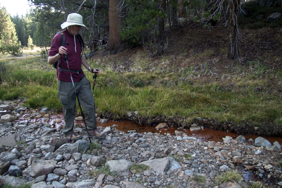 Bill inspects the iron oxide seep from Vomit Creek one last time.