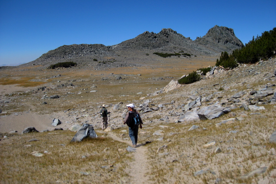 Bill and Stella head down across the plateau.