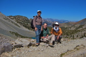 Stella, Bill, and Frank stop briefly for a photo near Duck Pass.