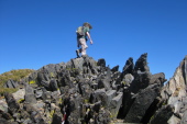 Bill climbs to the top of the pika poop-covered gendarme.