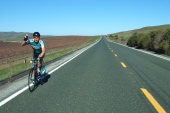 Barry Burr rides past the vineyards alongside Airline Highway.