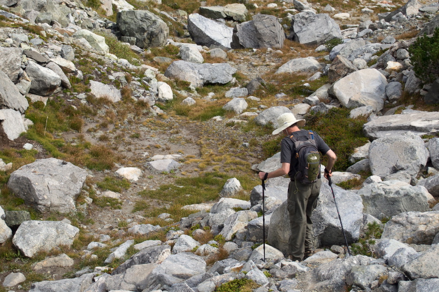 Bill leads the way down to a possible escape route from Cecile Lake.