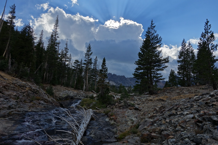 The sun goes behind a cloud over The Minarets.