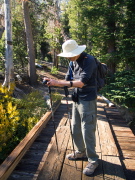 Bill steadies his camera on a hiking stick.