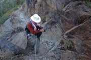 Frank photographs some late-season penstemon surviving in cracks in the west-facing cliff.
