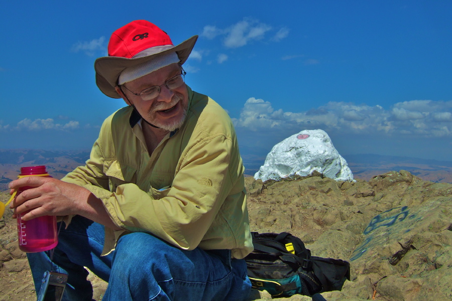 Marty enjoys a drink on the summit.