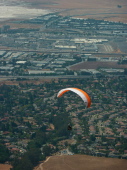 Paraglider over the trailhead parking lot.