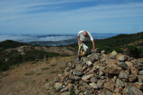 David checks out the pile of rocks on Peak Mountain.