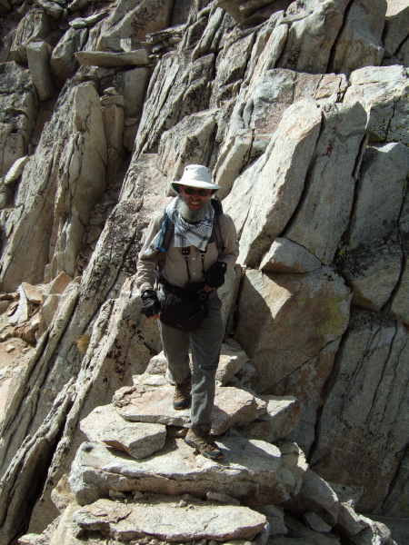 Frank walks across the narrow part of the arête.