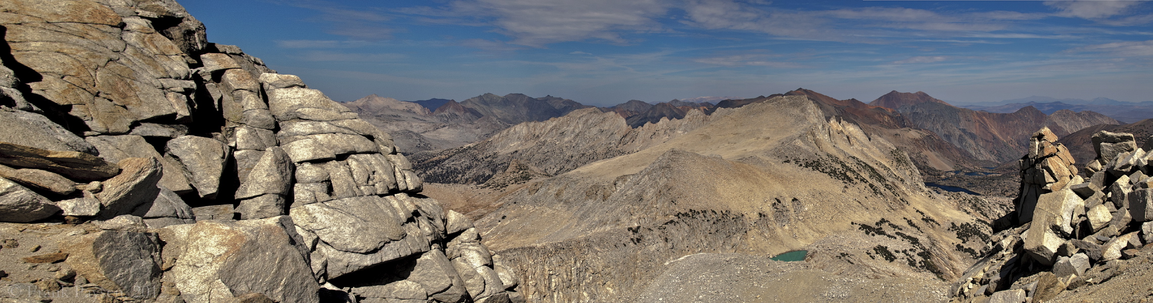 North Peak (12242ft) and the small glacial tarn can be seen down the northeast side of the ridge.