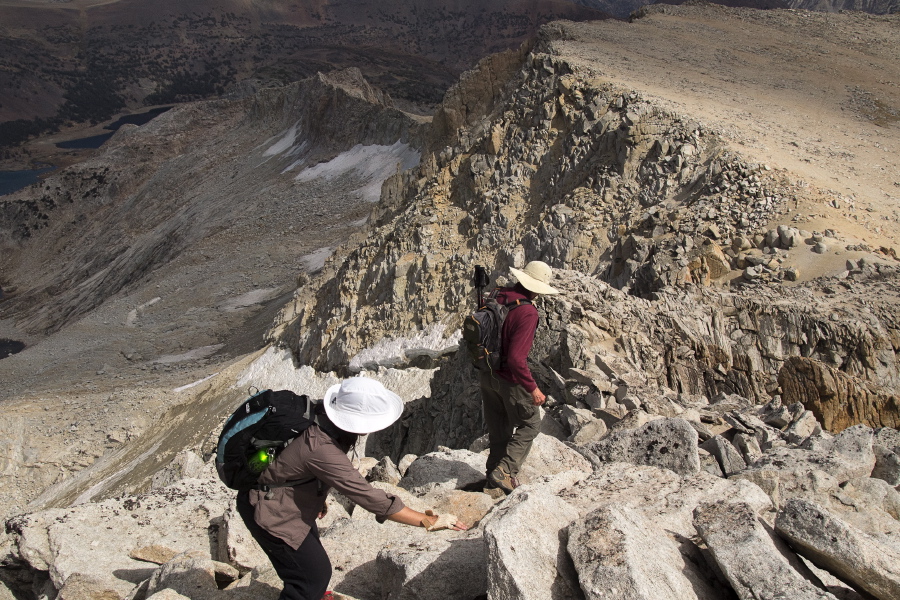 Bill and Stella start down the arête from the summit.