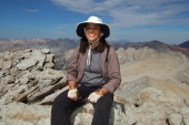 Stella on the summit block of Mt. Conness