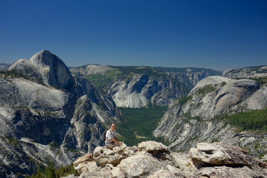 Bill sits at the brink of the south summit of Mount Watkins.