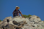 David enjoys his perch on south summit of Mount Watkikns.