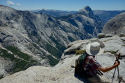 David enjoys the view of Half Dome as close to the edge as he dares to sit.