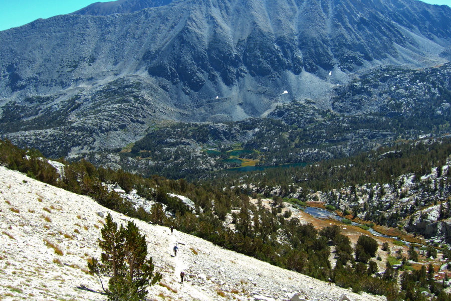 Stella, Frank, another hiker, and further down, David, climb the switchbacks to Mono Pass.