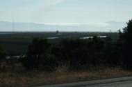 Fog pours through the CA92 gap from Half Moon Bay.