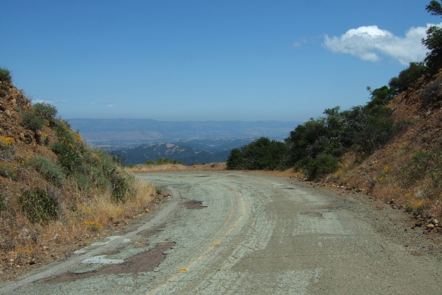 Mt. Umunhum Road passes through a cut in the ridge from west to east.