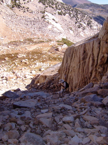 The easiest route to the Notch climbs next to a low cliff.