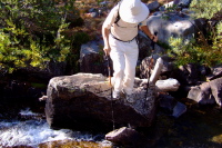 David crossing a stream.