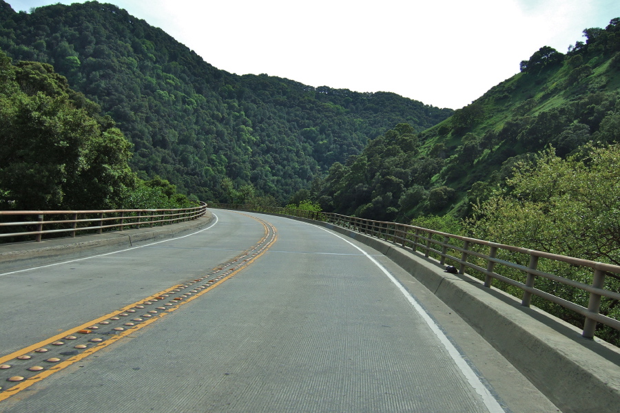 Riding over a narrow bridge.